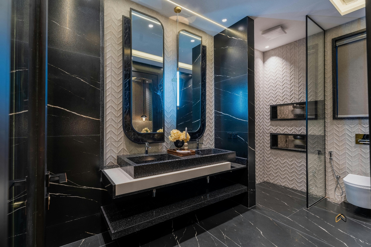 Nowoczesna łazienka — instalacje sanitarne, umywalka z armaturą, prysznic i toaleta w eleganckim wykończeniu